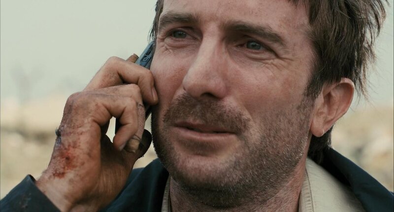 man with bloody hand on phone
