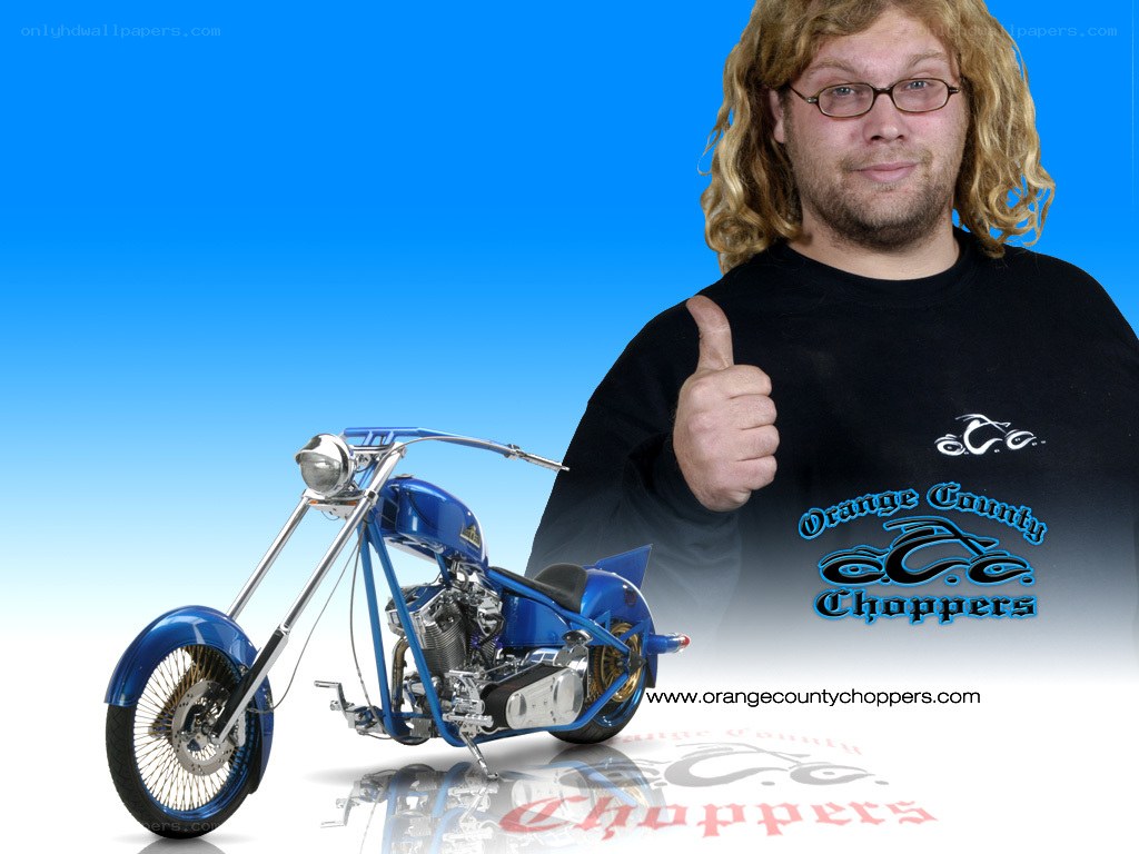 Man with blue chopper motorcycle