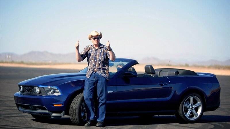 Man with blue convertible car