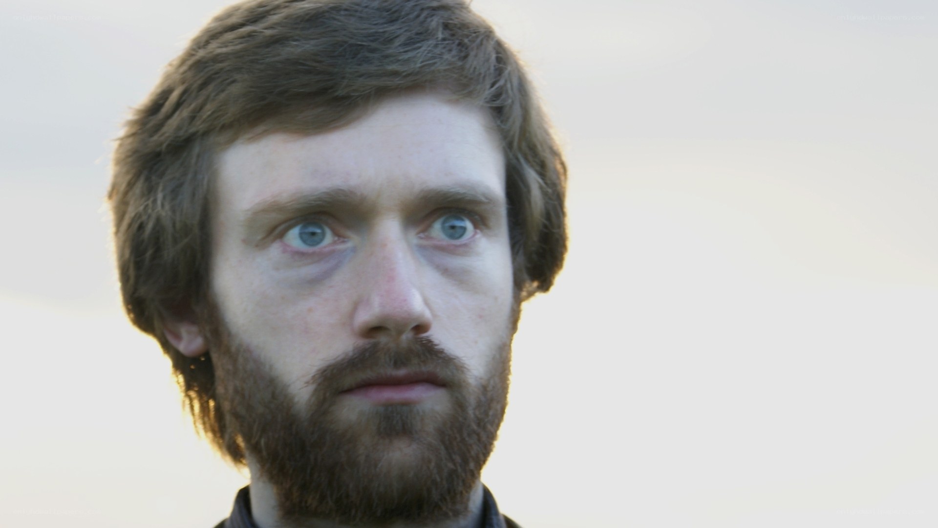 man with blue eyes and beard