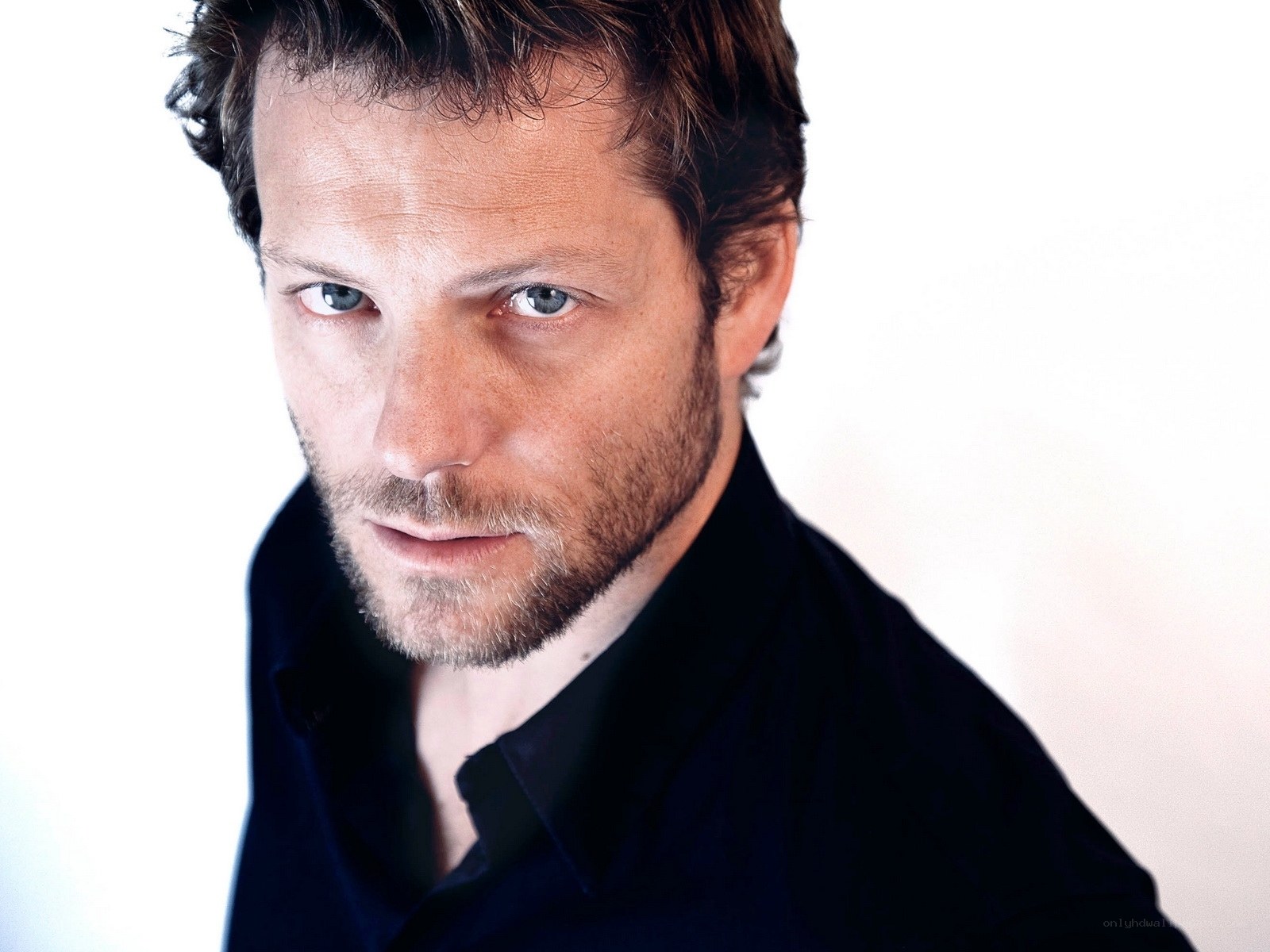 man with blue eyes and beard