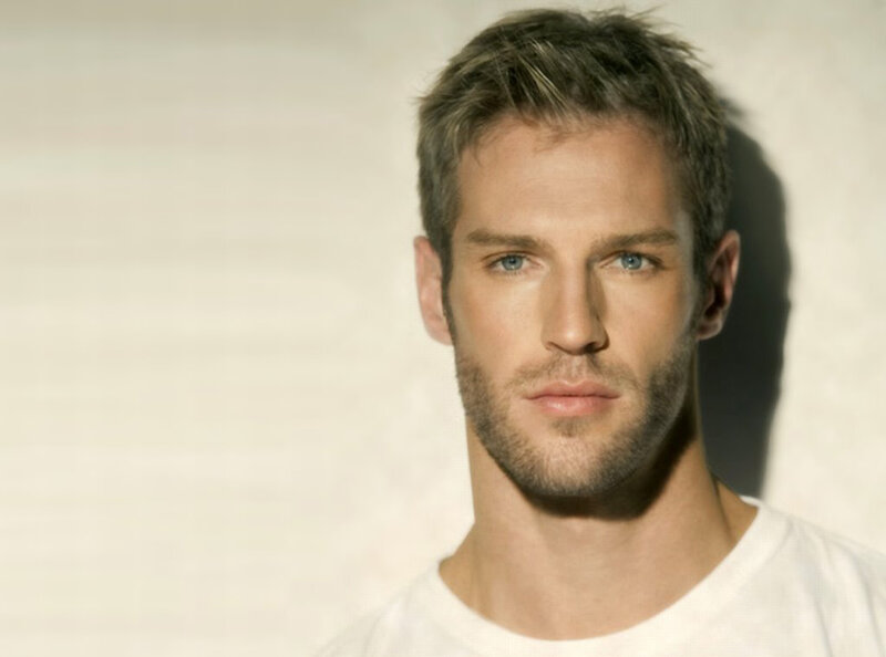 man with blue eyes and stubble