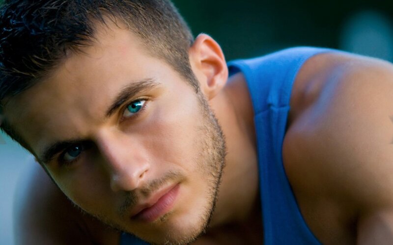 man with blue eyes in tank top