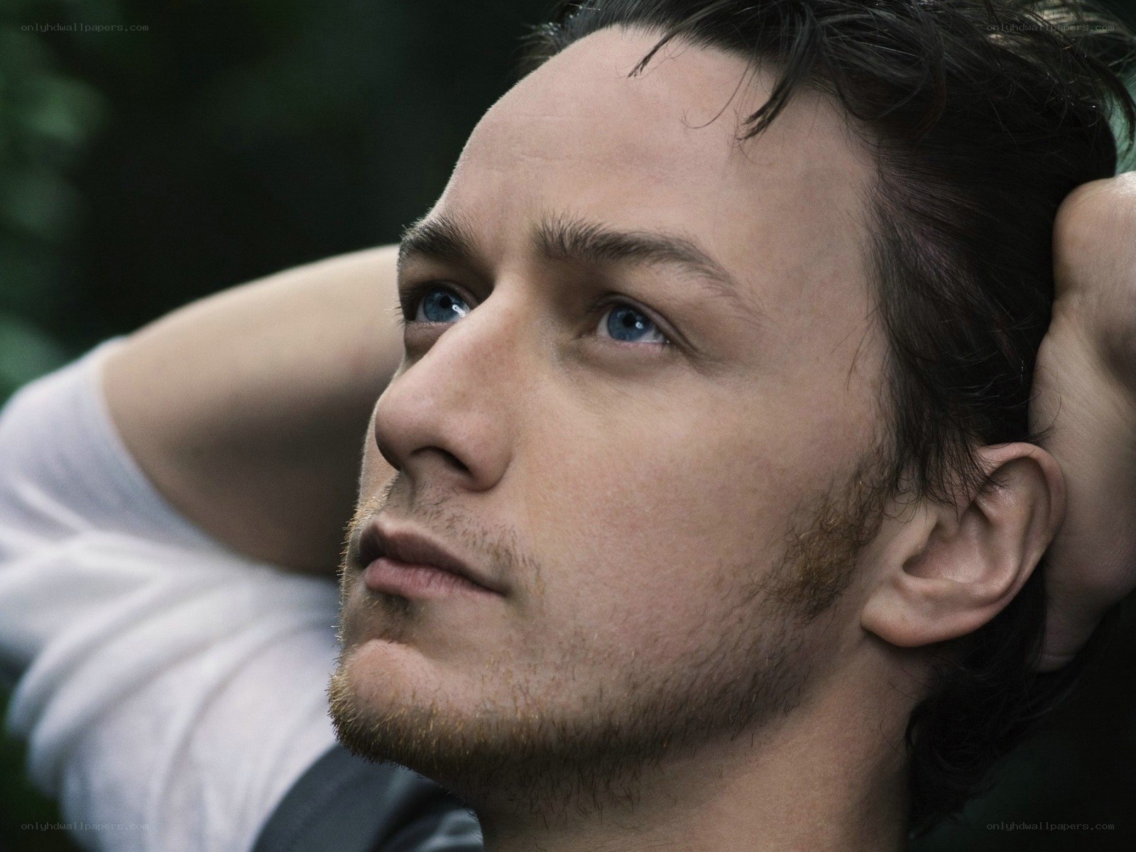 man with blue eyes looking up
