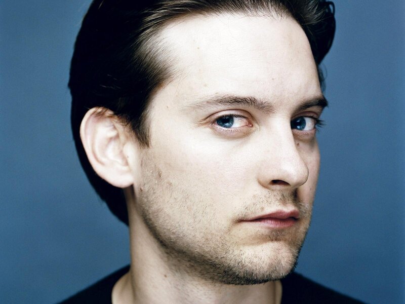 Man with Blue Eyes — Neutral, Photograph, Blue Background, Black Shirt
