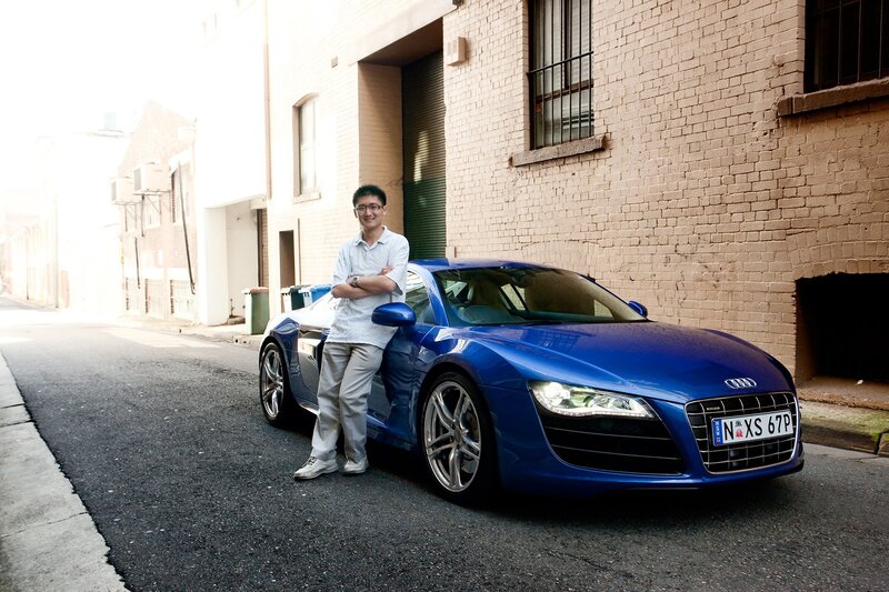 Man with blue sports car