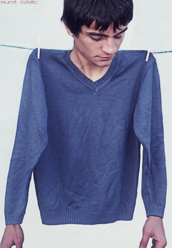 Man with blue sweater