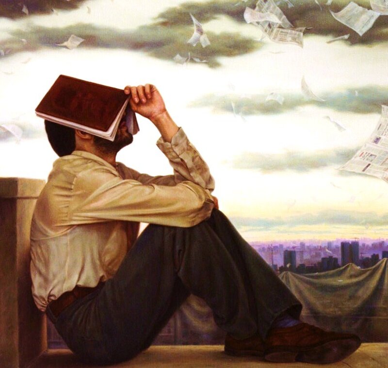 Man with book on head