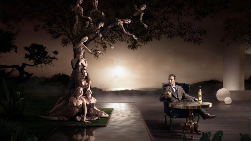 man with bottle and women in tree