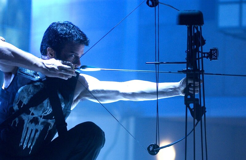 Man with bow aiming