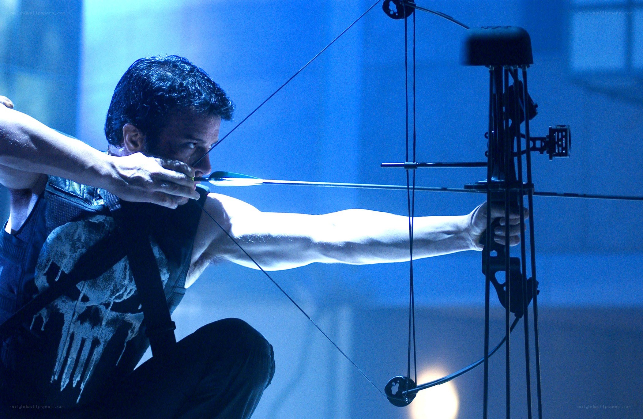Man with bow aiming