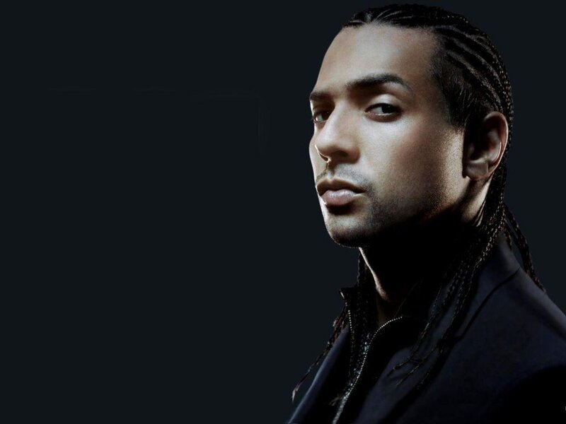 man with braided hair in profile