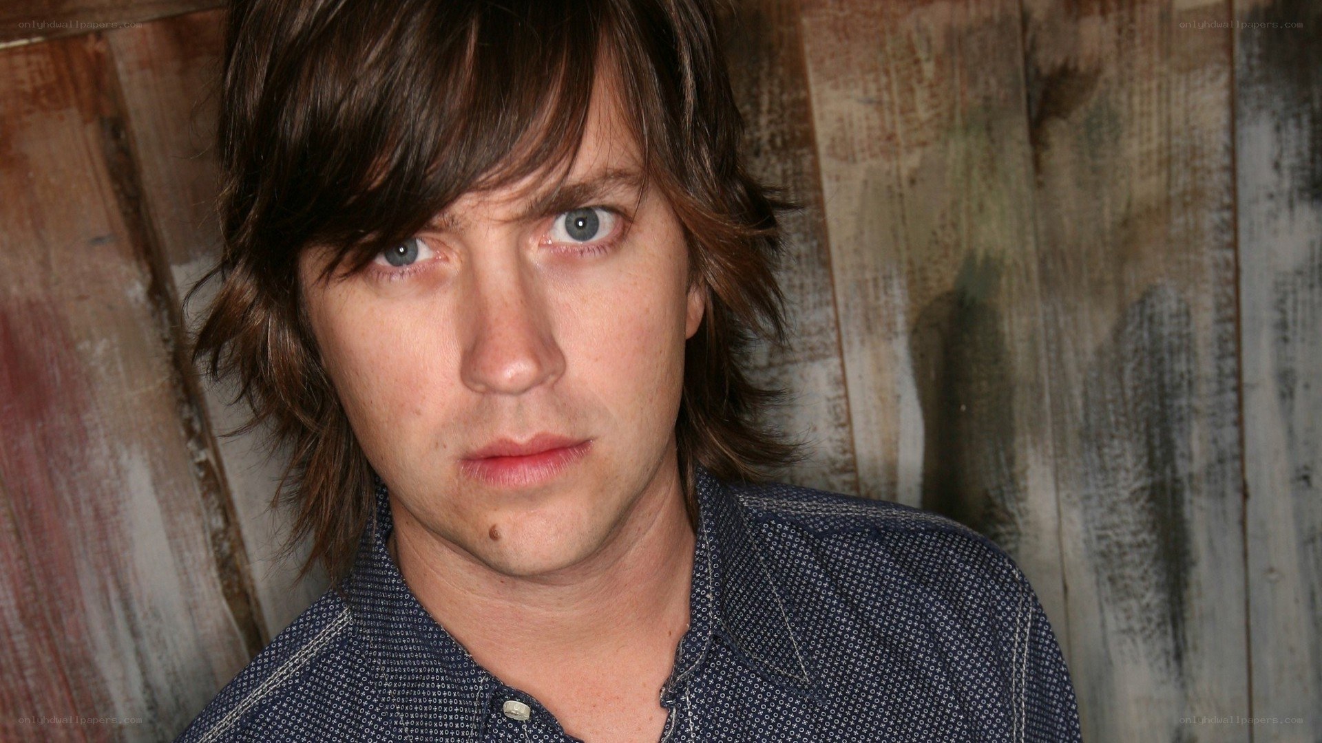 man with brown hair and blue eyes