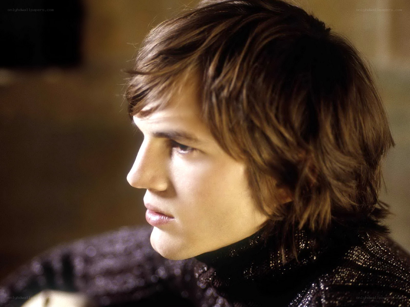 man with brown hair in profile