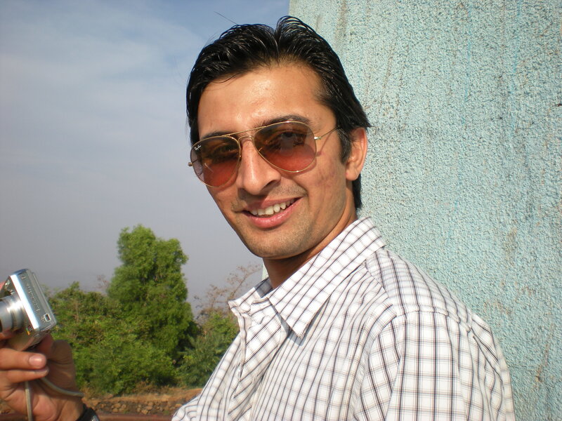 man with camera and sunglasses