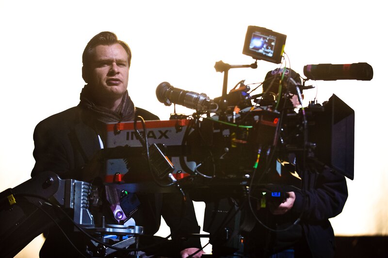 Man with Camera Equipment — Black, Dramatic