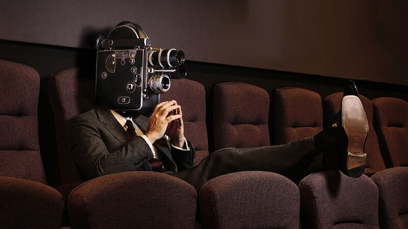 Man with camera for a head