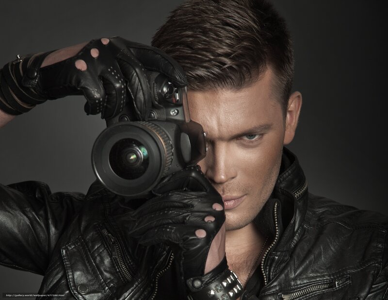 man with camera in leather jacket