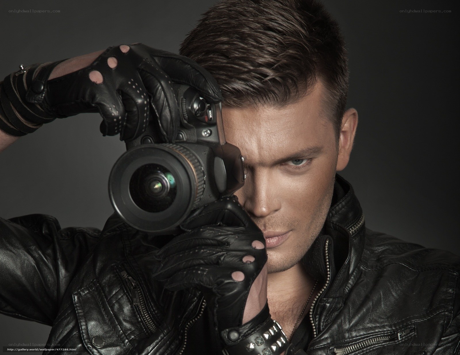 man with camera in leather jacket