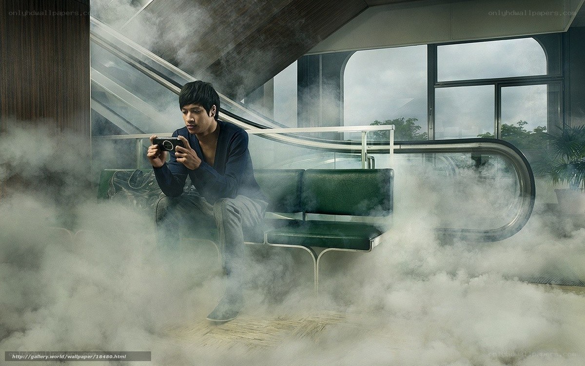 Man with camera in smoky station