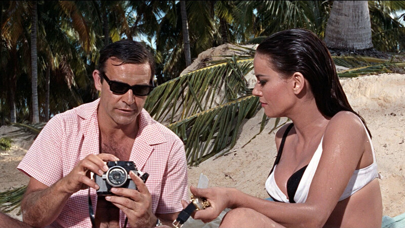 Man with camera on beach