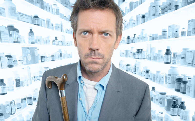 Man with Cane in Pharmacy — Gray, Serious