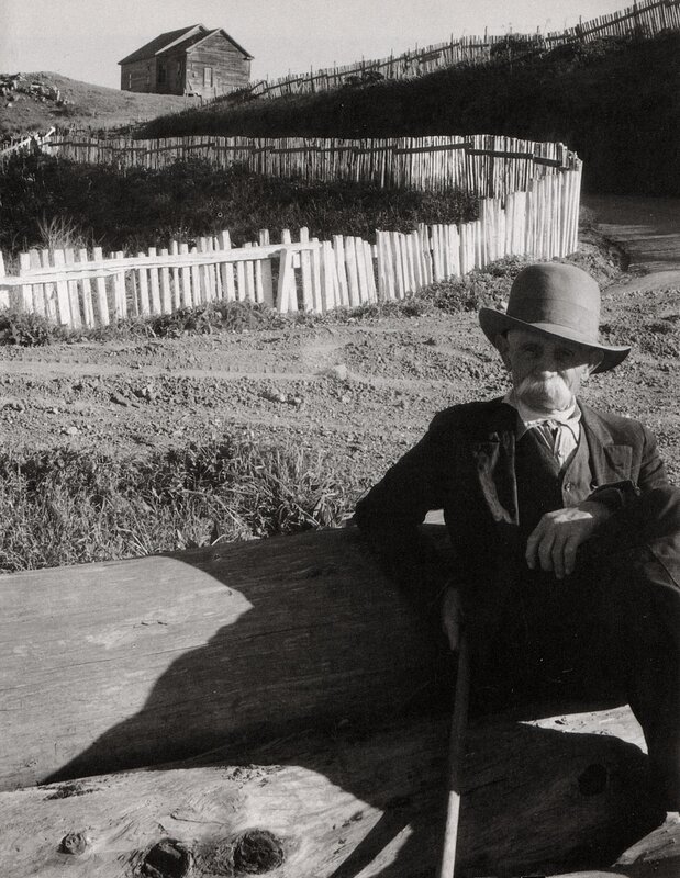 Man with cane in rural setting