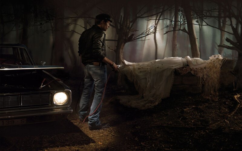 Man with car and woman in forest
