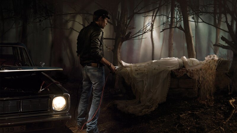 Man with car and woman in forest