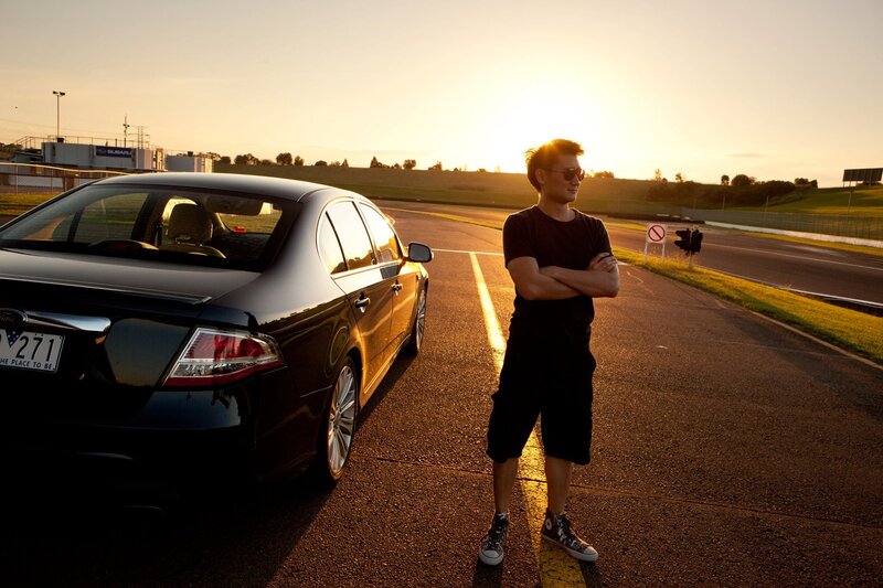 Man with car at sunset