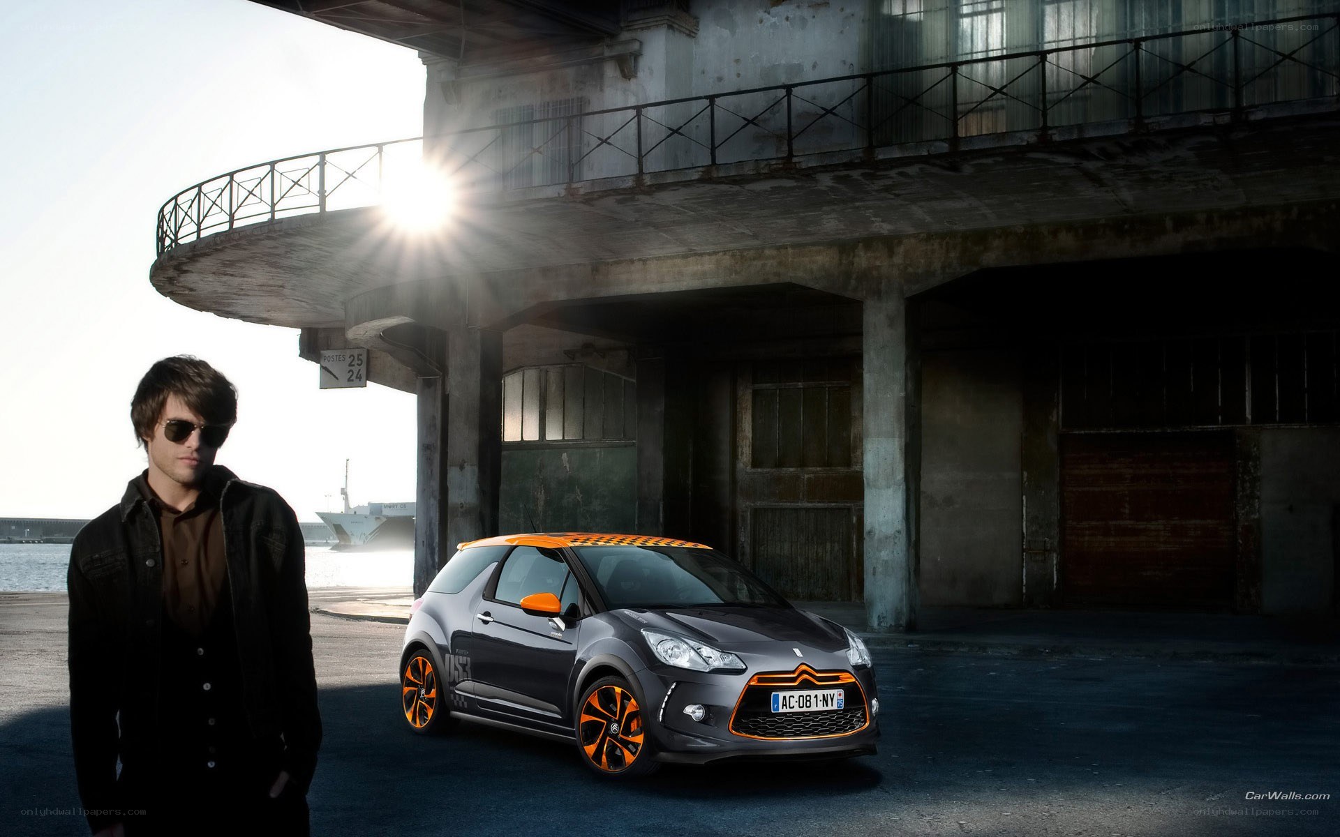 Man with car in industrial setting