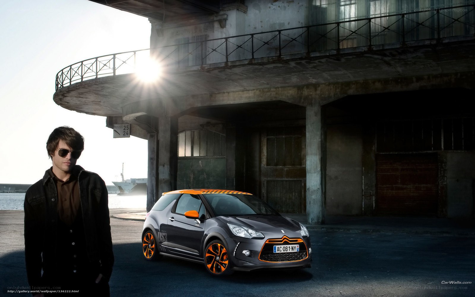 Man with car in industrial setting