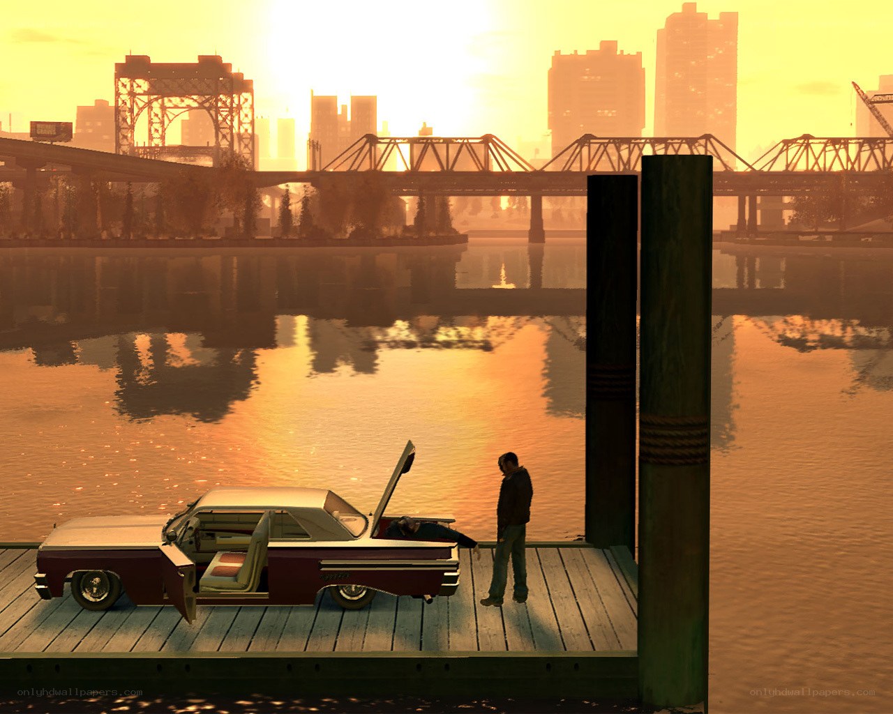 Man with car on dock at sunset