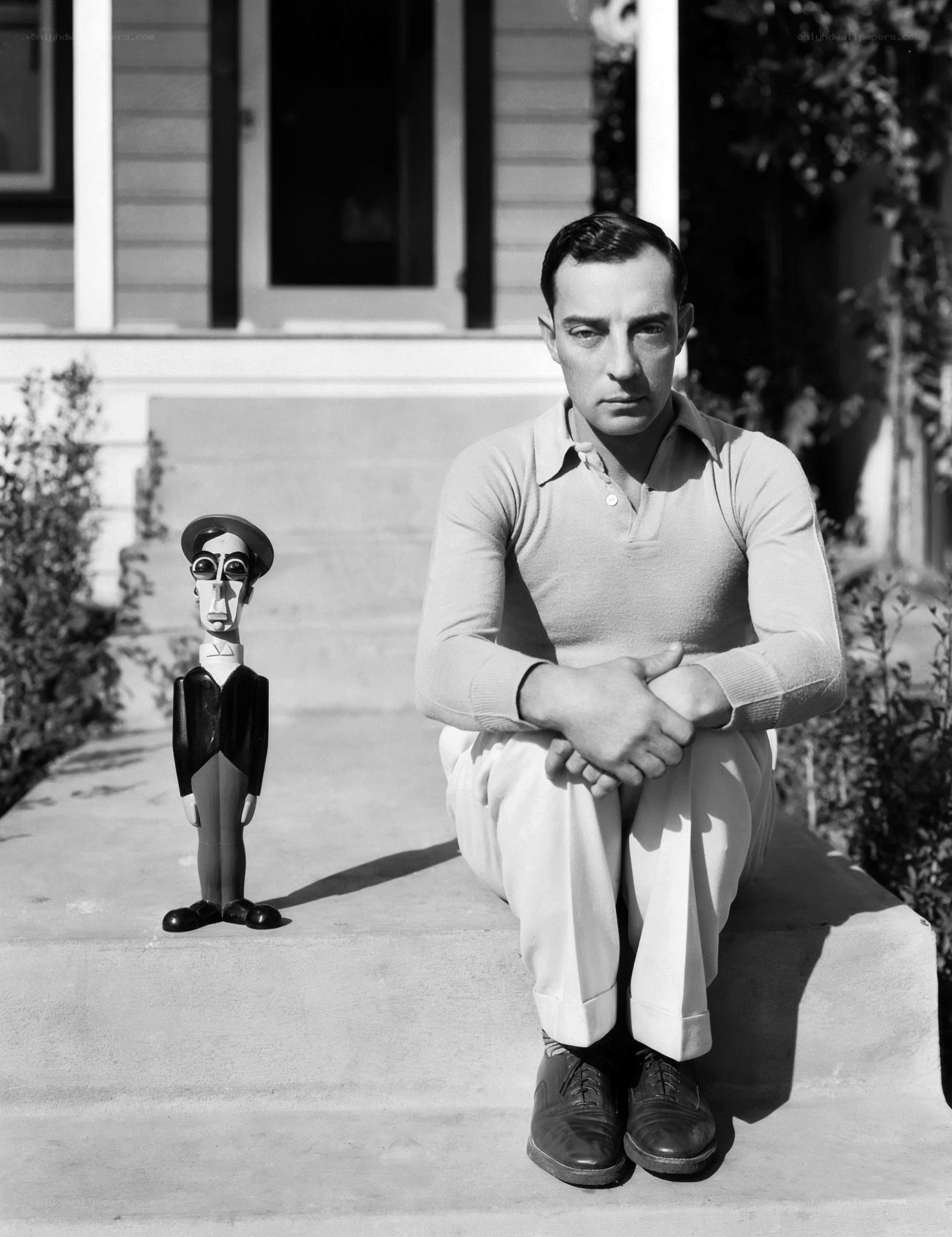 Man with caricature statue