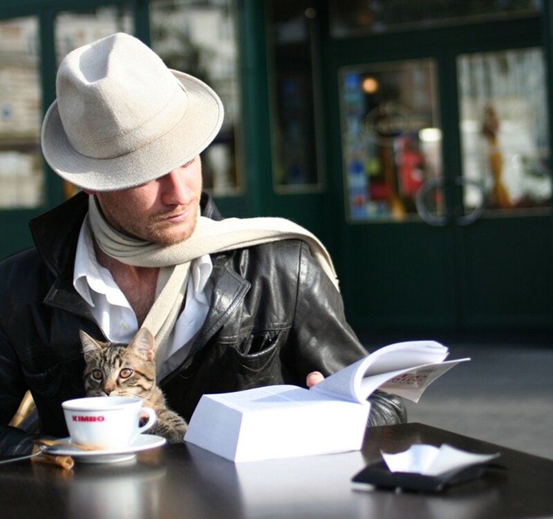 Man with Cat at Cafe