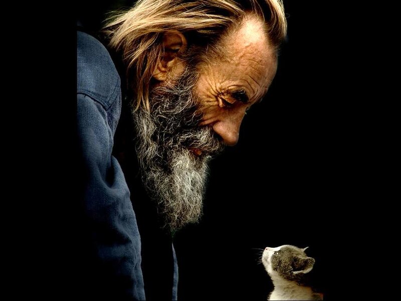 man with cat looking down
