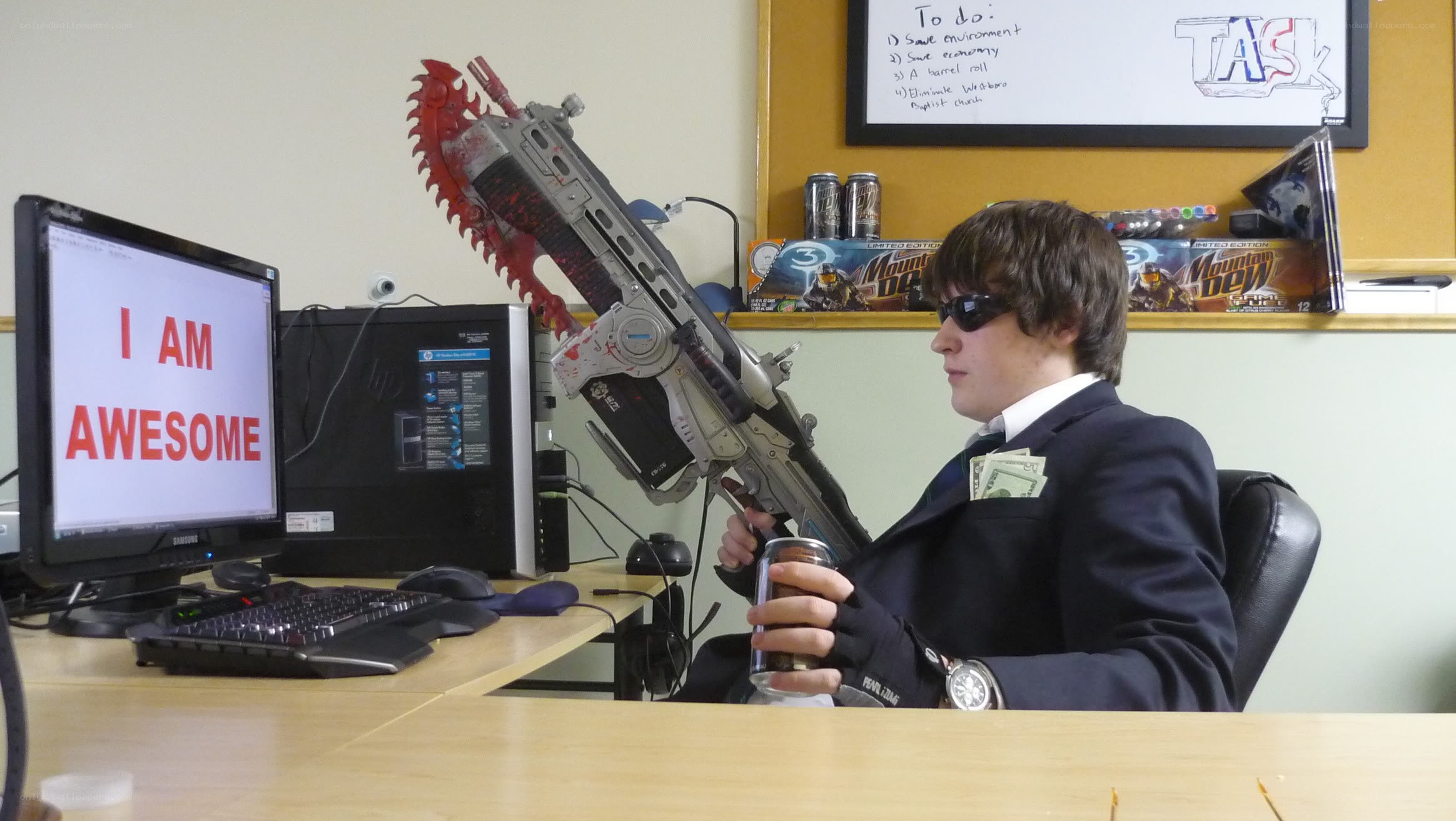 Man with chainsaw gun at desk