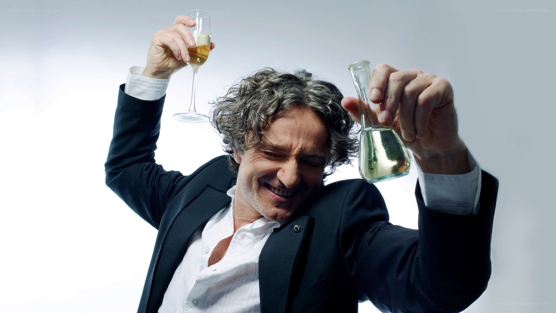 Man with champagne and flask