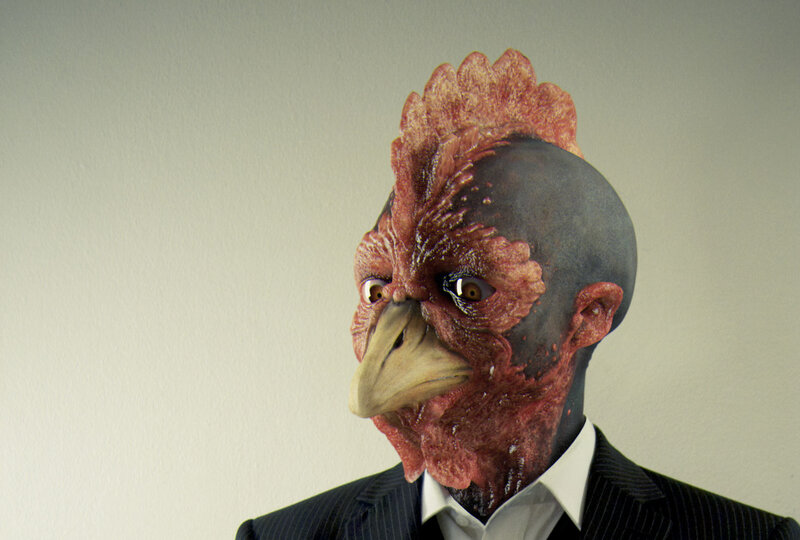man with chicken mask