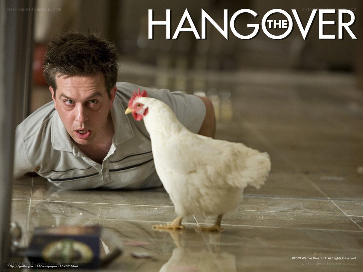 Man with chicken on floor