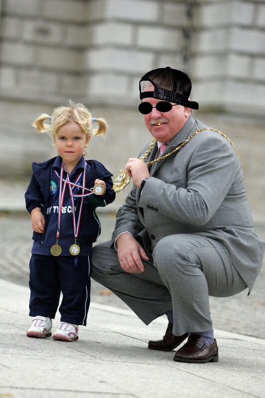 Man with child and medals