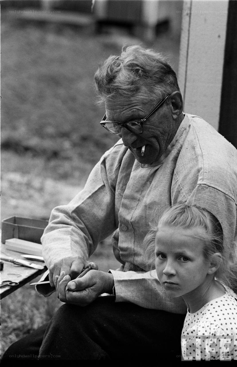 man with child at workbench