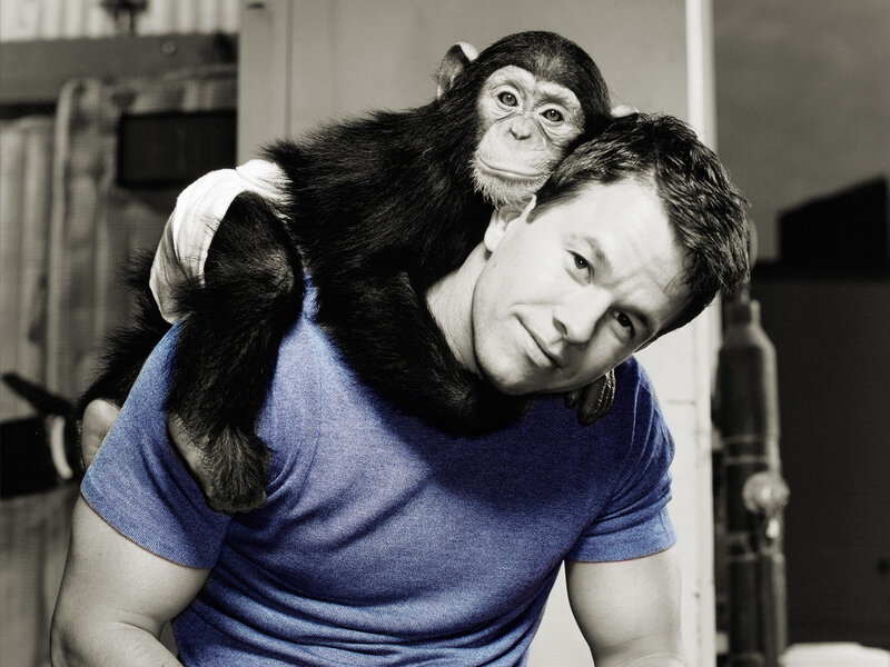Man with chimpanzee on shoulder