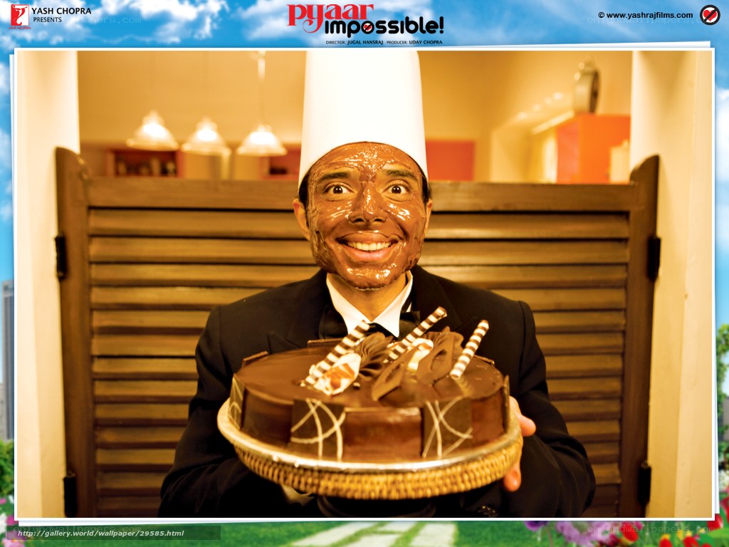 man with chocolate face holding cake