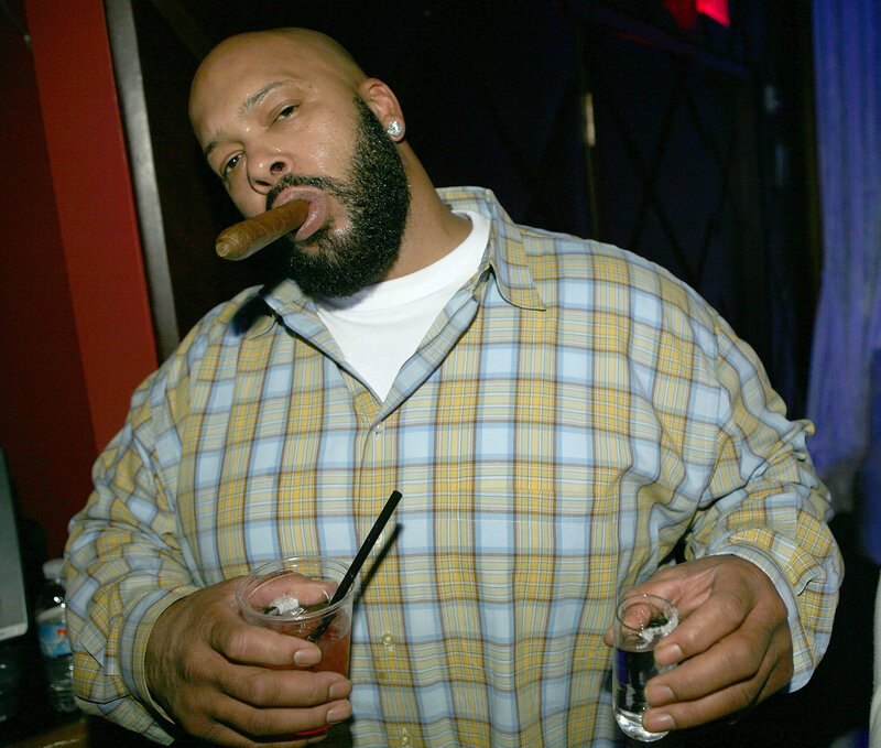 Man with cigar and drinks