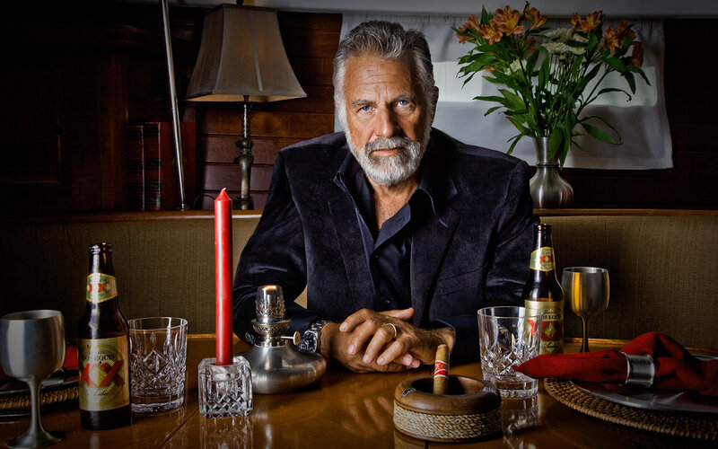 Man with cigar at dining table