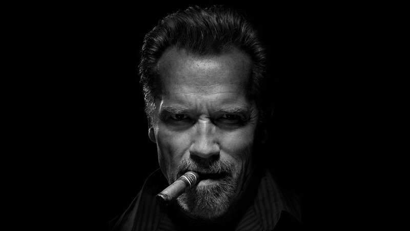 man with cigar in black and white