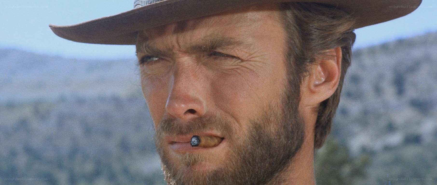 man with cigar in cowboy hat