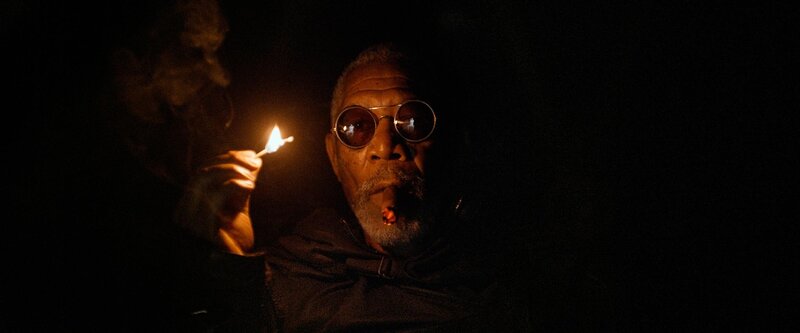 man with cigar in dark