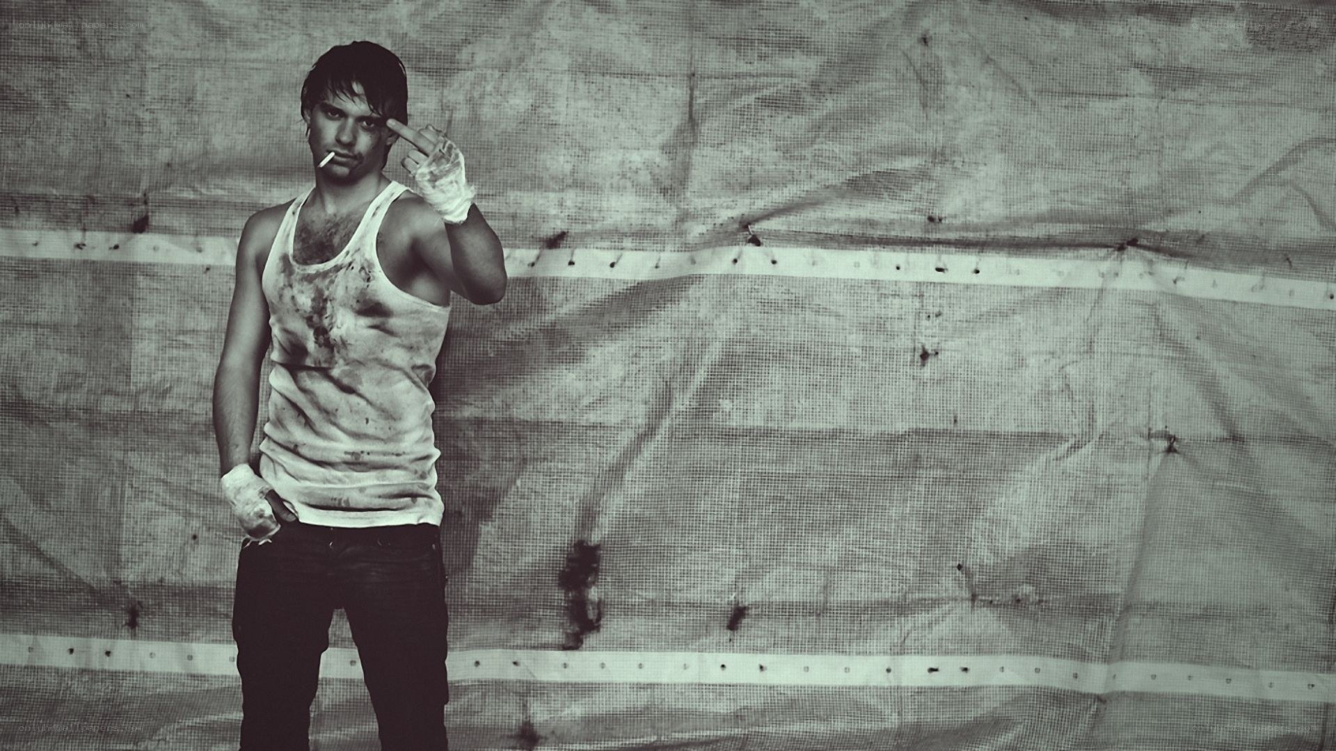 man with cigarette and bandaged hands